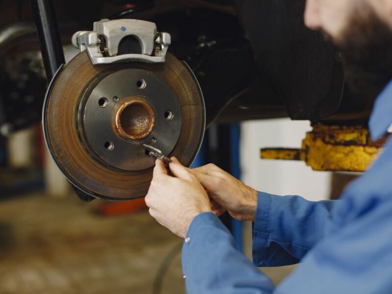 Mechanic working on a brake disc and hub